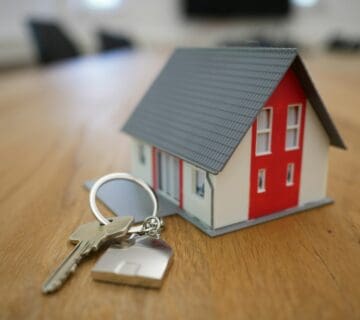 House keys beside model home