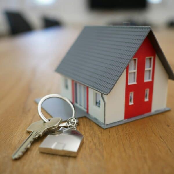 House keys beside model home