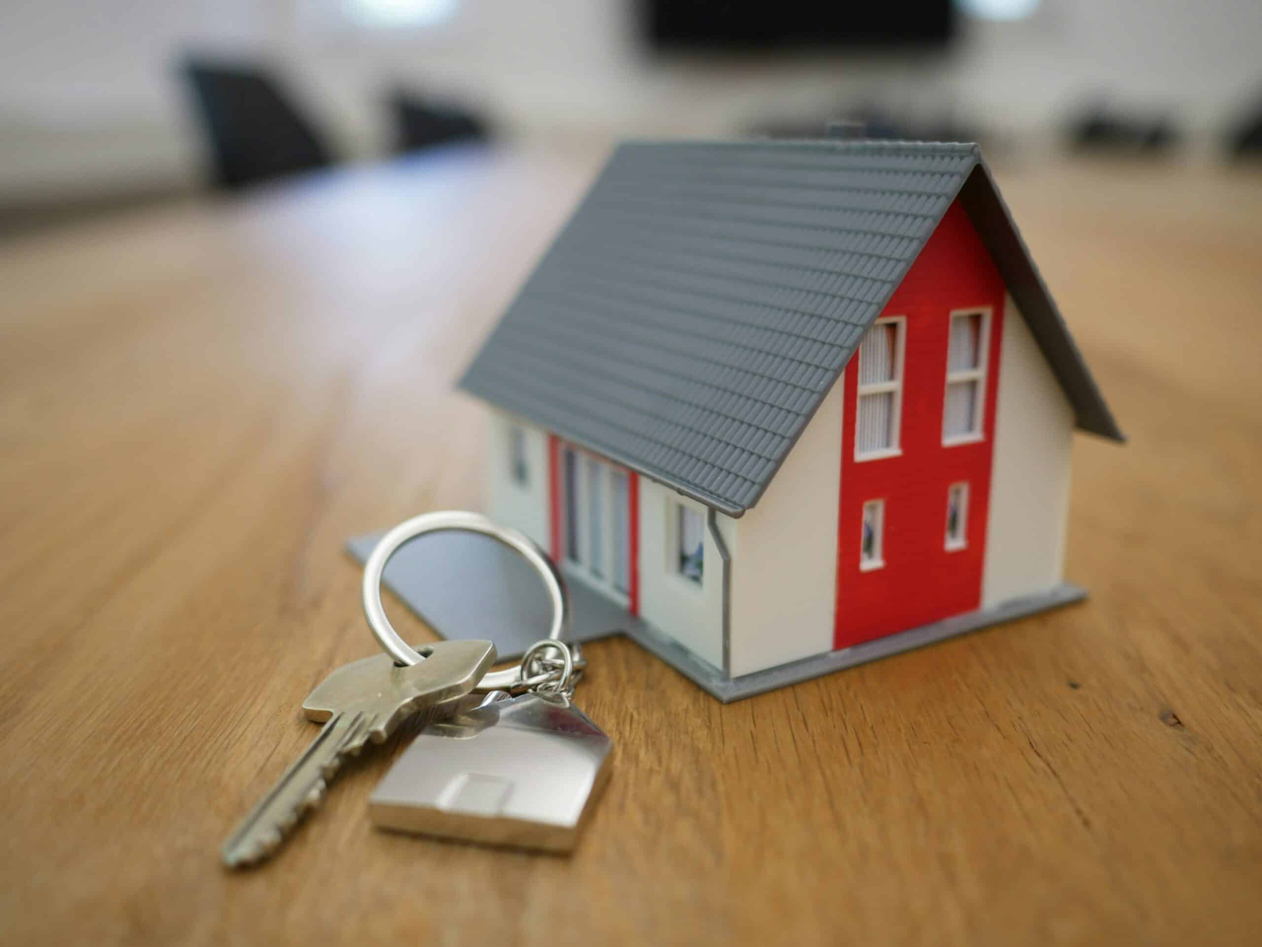 House keys beside model home
